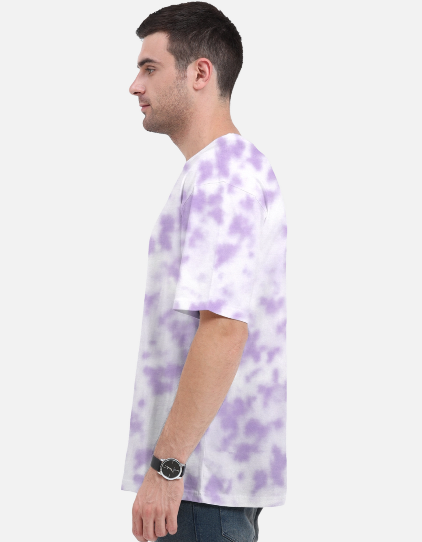 Man wearing a white t-shirt with purple tie-dye pattern on a plain background